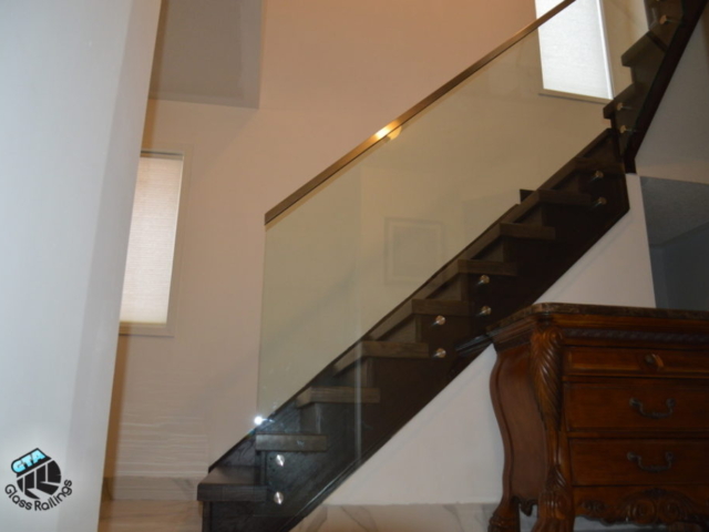 framless glass railing with stainless steel handrail