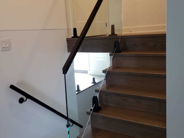 Glass railing wood handrail